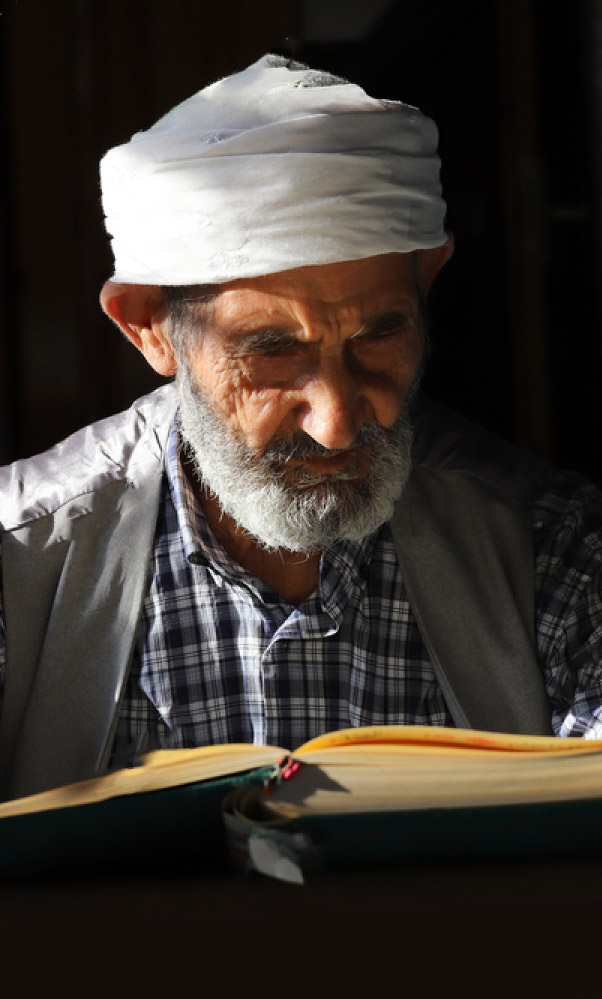 stock-photo-sanliurfa-turkey-lake-district-people-of-urfa-the-man-who-reads-the-qur-an-2005892021